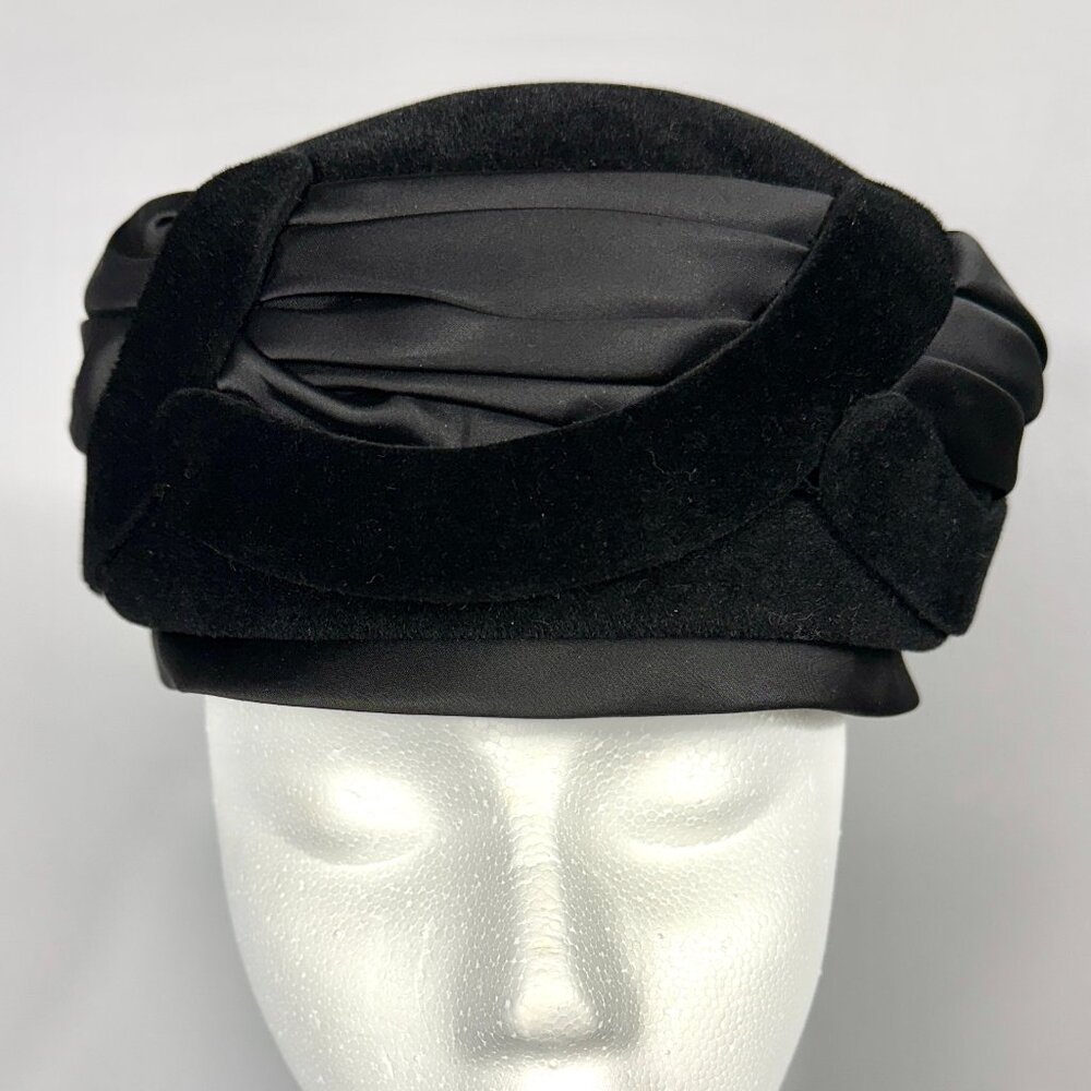 Little Black Hat with velvet cutout overlays.